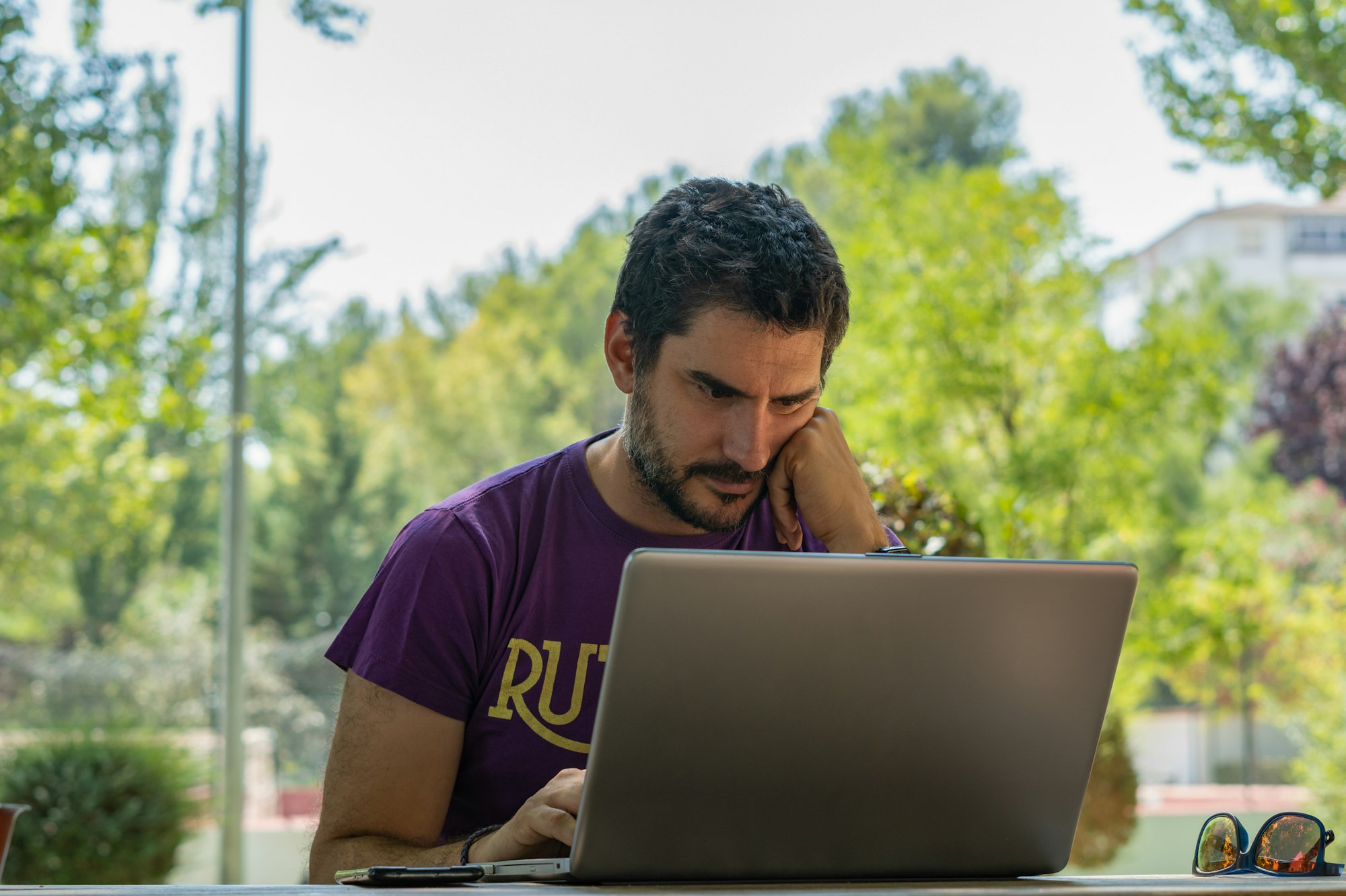 man with pc in the park